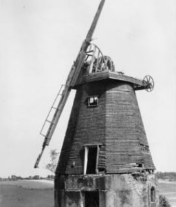 Old Mill, Hawkinge, roofless and derelict, with hills in background